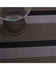 Grey-toned multi stripe outdoor Chilewich mat.
