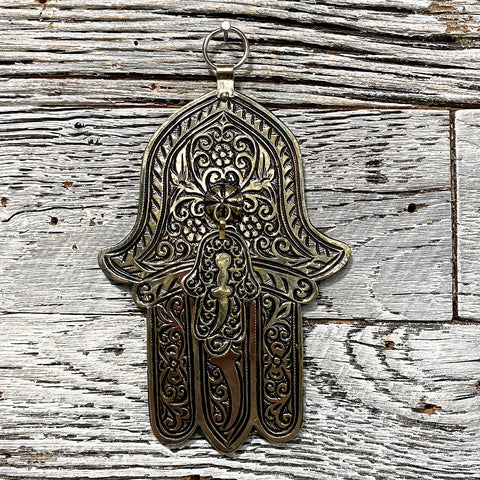 Silver Hamsa on wood